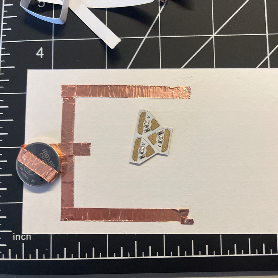 Making edits to our circuit to try and get it to work. What we didn't know is the positive and negative side of the lights