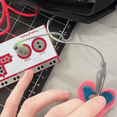 I created a heart out of felt and conductive fabric that affects the P5 when touched.